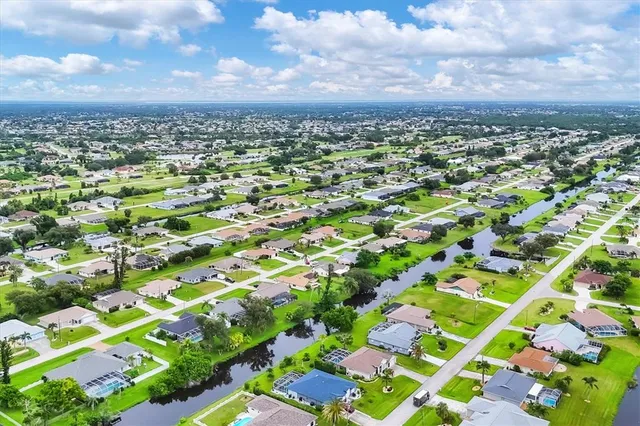 a view of a swimming pool with a yard