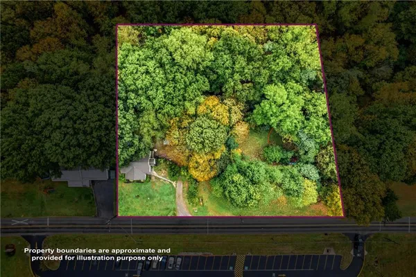 a kitchen with granite countertop white cabinets stainless steel appliances and a sink