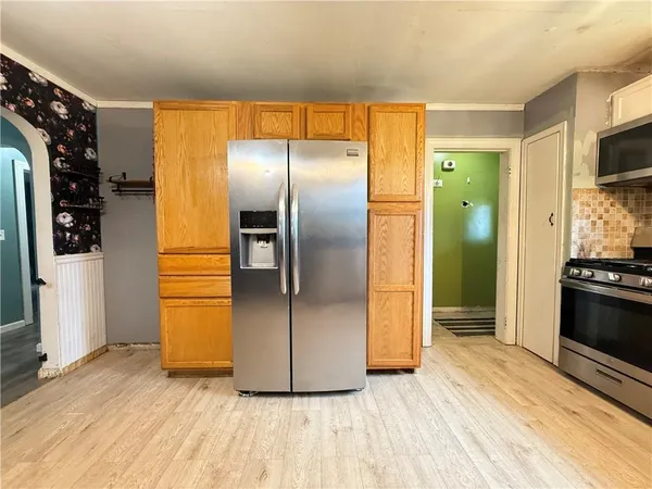 a kitchen with a wooden floor