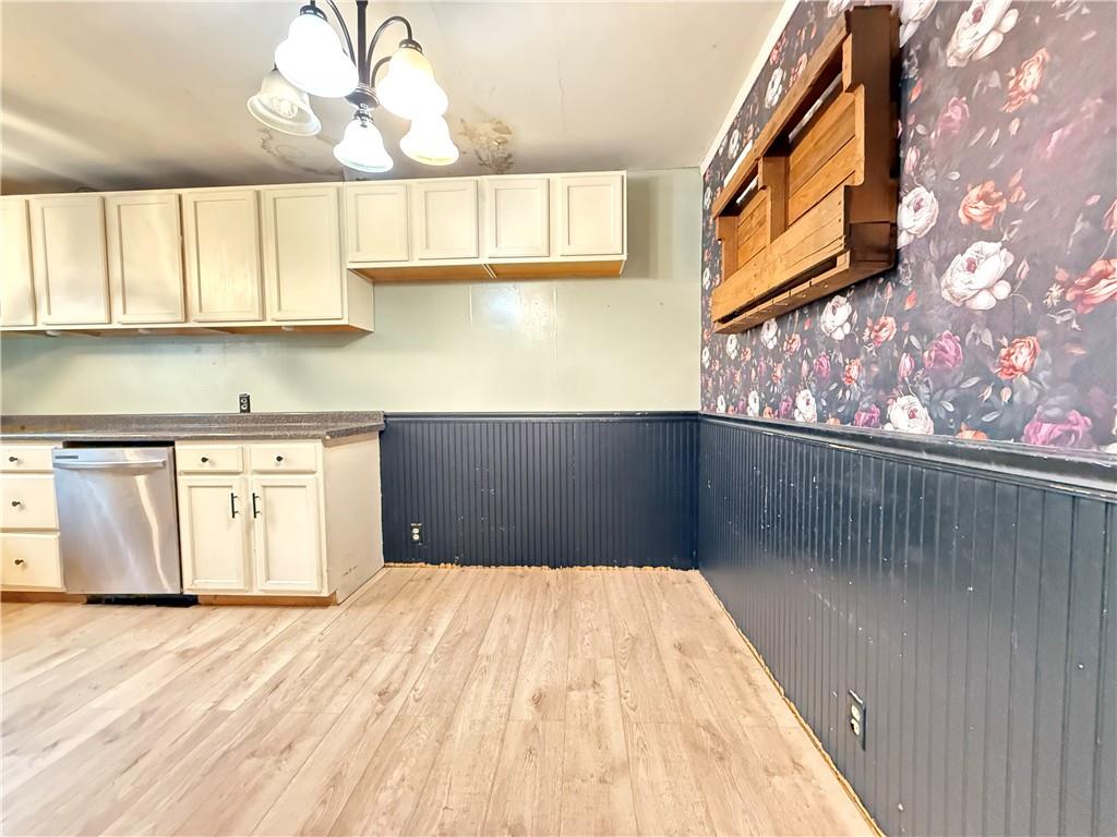 63 Fredonia Road Greenville, PA 16125 - Photo 17 of 32 a kitchen with a wooden floor