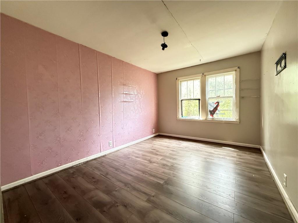 63 Fredonia Road Greenville, PA 16125 - Photo 24 of 32 wooden floor in an empty room with a window