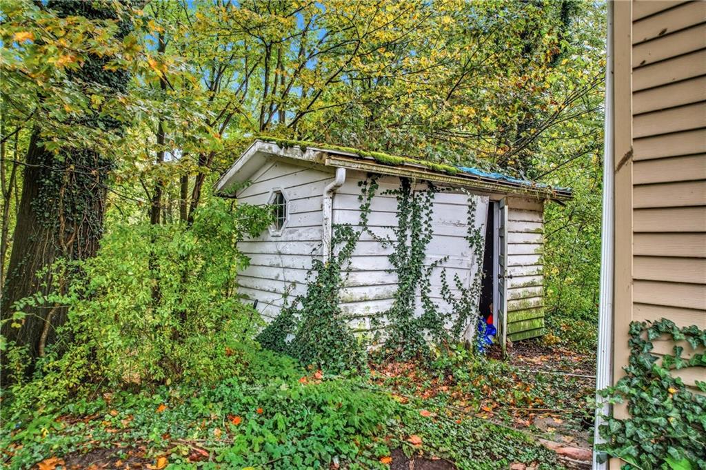 63 Fredonia Road Greenville, PA 16125 - Photo 8 of 32 a house is sitting in middle of the green field