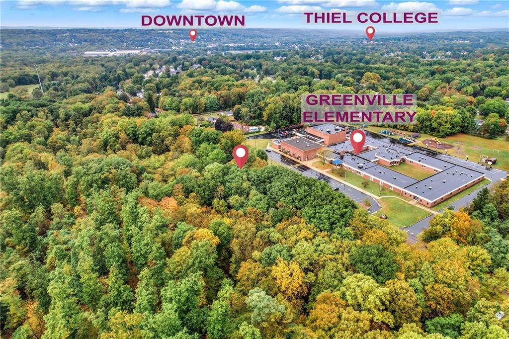 63 Fredonia Road Greenville, PA 16125 - Photo 10 of 32 a sign that is sitting on a wooden wall