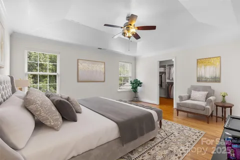 a bedroom with a large bed and a couch