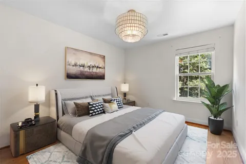 a bedroom with bed and a window