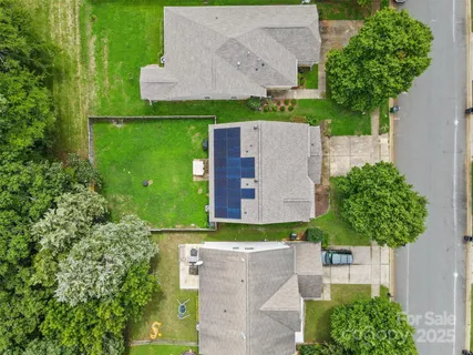 an aerial view of a house with a garden