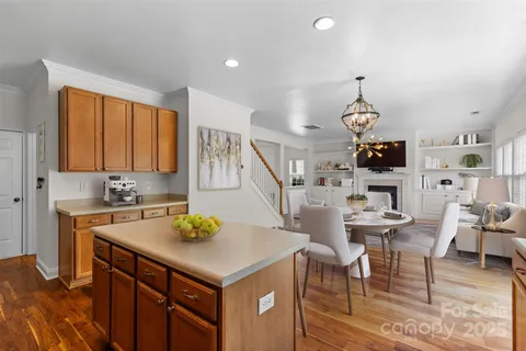 a view of kitchen island sink and living room