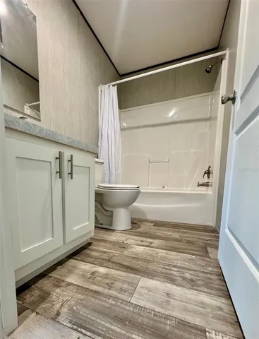 a bathroom with a shower and a toilet
