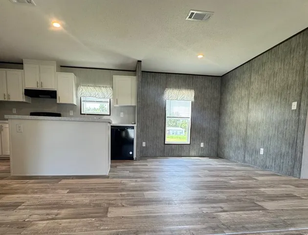 a view of kitchen and front door