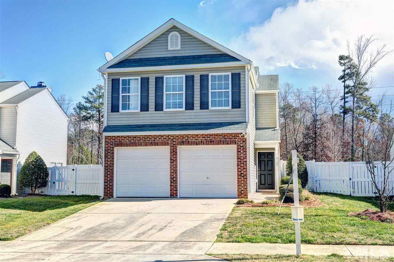 8108 Inverbrass Court Raleigh, NC 27616 - Photo 1 of 25 a front view of a house with a yard and garage