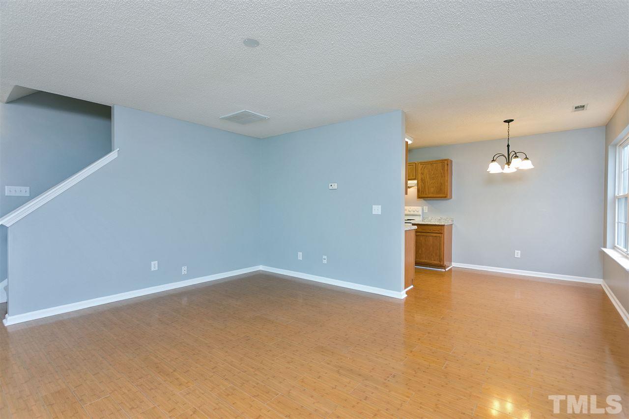 8108 Inverbrass Court Raleigh, NC 27616 - Photo 2 of 25 a view of a big room with wooden floor and windows