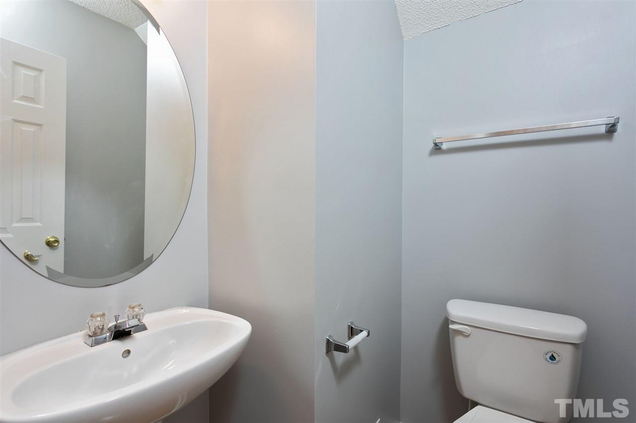 8108 Inverbrass Court Raleigh, NC 27616 - Photo 12 of 25 a bathroom with a sink mirror and toilet
