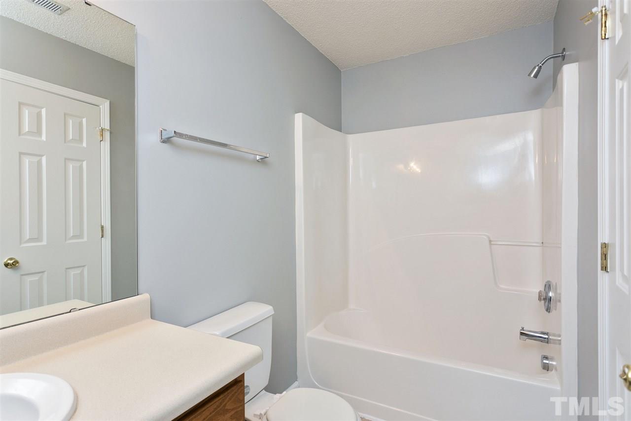 8108 Inverbrass Court Raleigh, NC 27616 - Photo 16 of 25 a bathroom with a bathtub and a shower