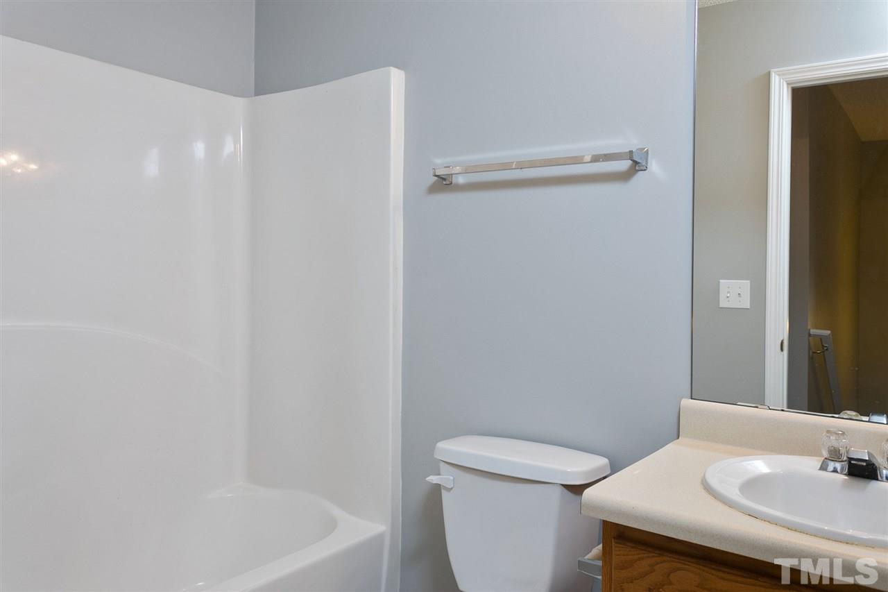 8108 Inverbrass Court Raleigh, NC 27616 - Photo 17 of 25 a bathroom with a sink a toilet and shower