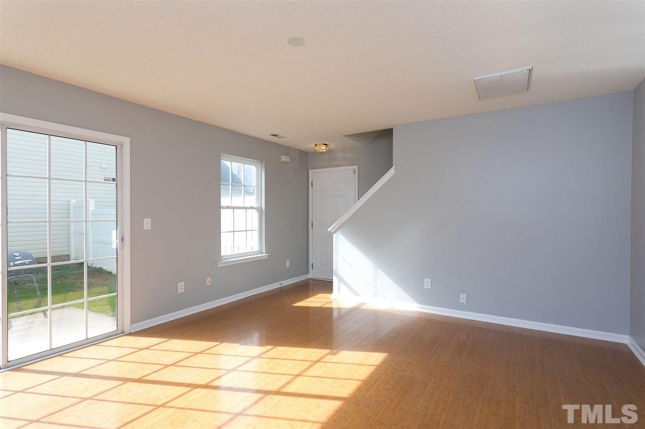 8108 Inverbrass Court Raleigh, NC 27616 - Photo 5 of 25 a view of a big room with windows