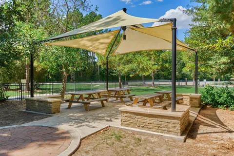 a view of grassy field with benches