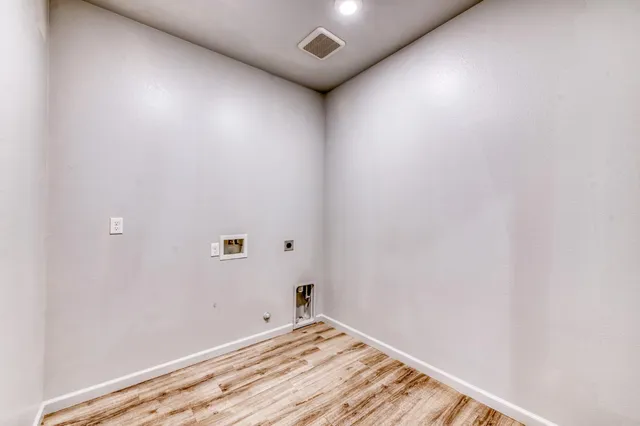 a bathroom with a sink mirror and toilet