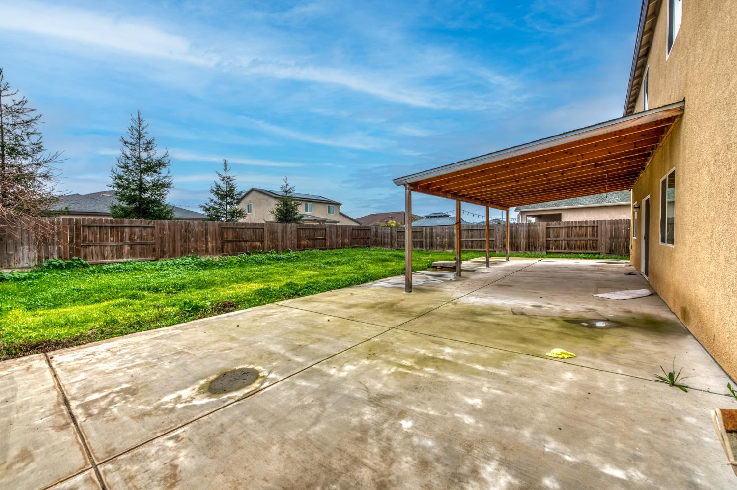 1391 Shoreside Drive Madera, CA 93637 - Photo 27 of 30 a view of a patio with a table and chairs under an umbrella