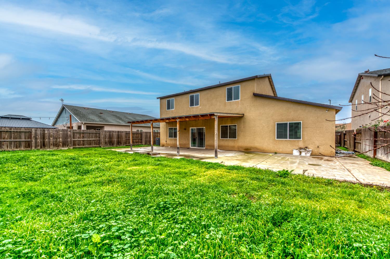 1391 Shoreside Drive Madera, CA 93637 - Photo 29 of 30 a front view of a house with a yard and porch
