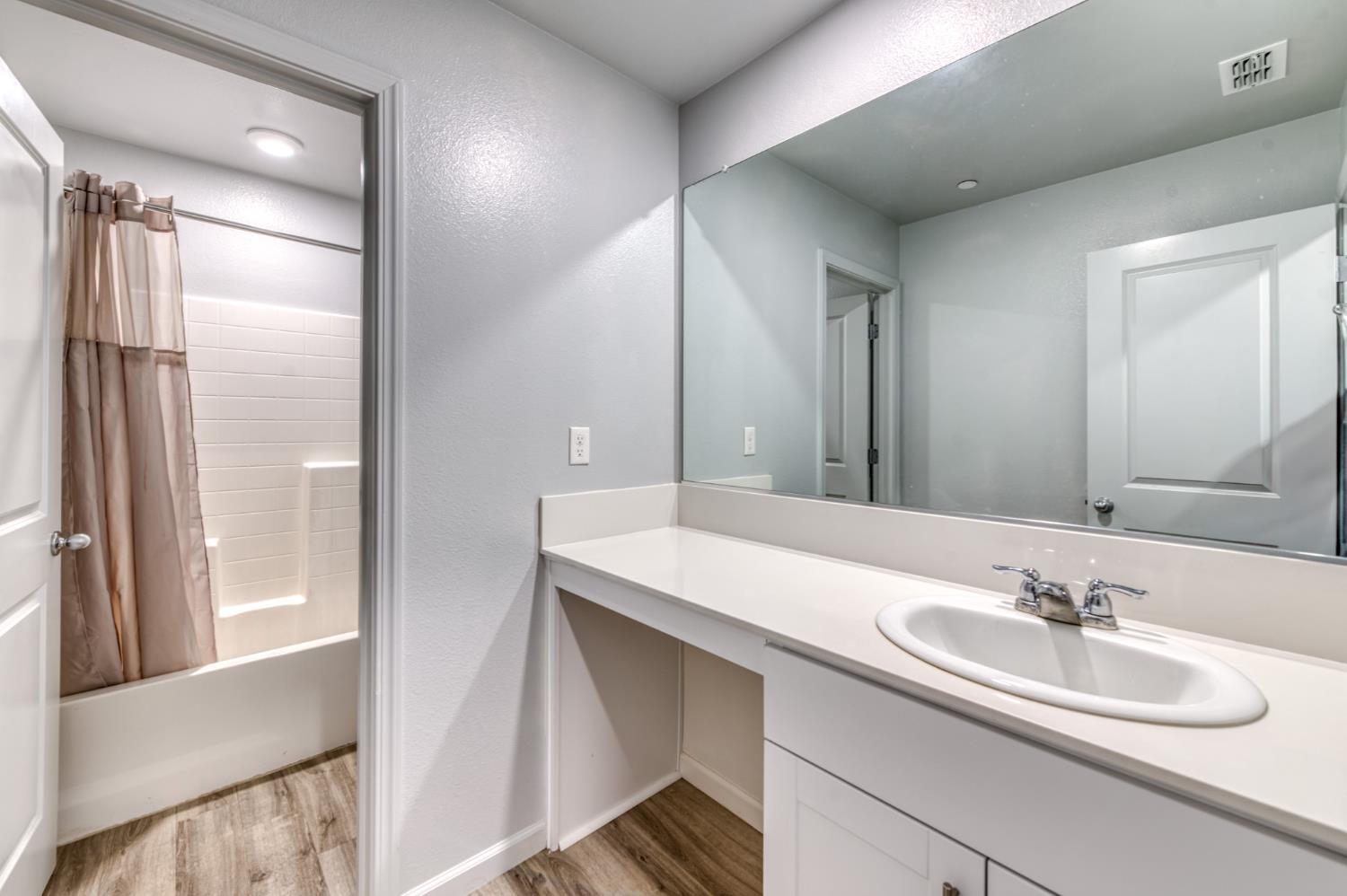 1391 Shoreside Drive Madera, CA 93637 - Photo 4 of 30 a bathroom with a sink and a mirror