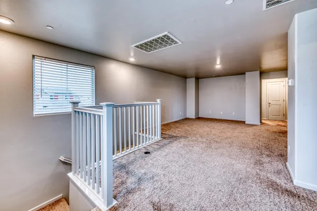 a view of walk in closet with clothes
