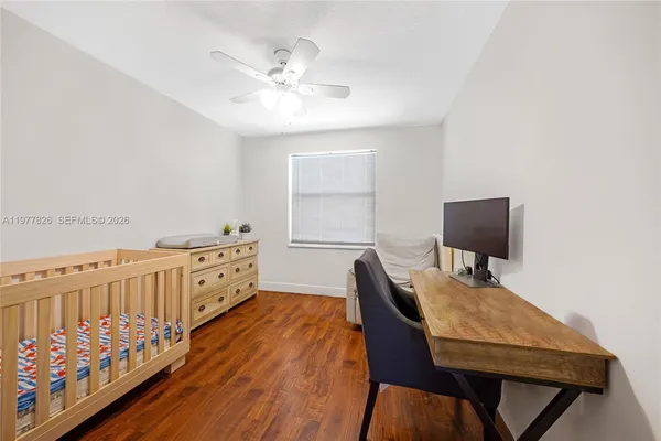 a workspace with furniture window and wooden floor
