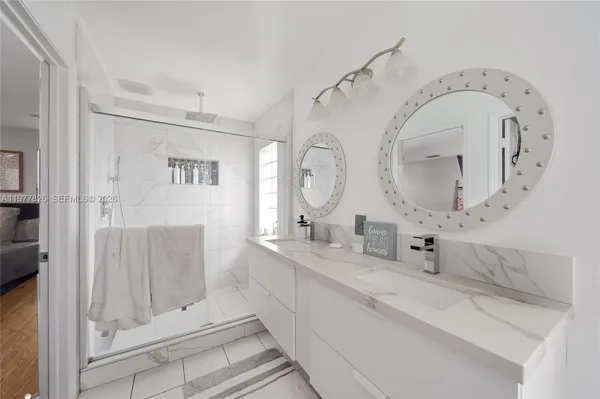 a spacious bathroom with double vanity sink and a mirror