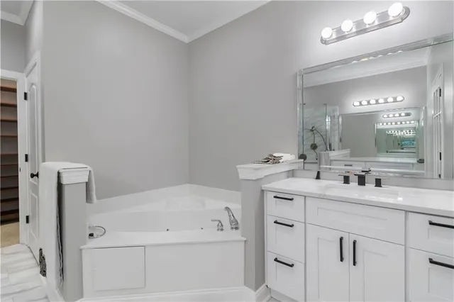 a bathroom with a double vanity sink mirror and