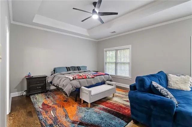 a bedroom with furniture and a window