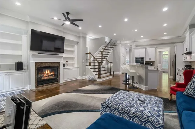 a living room with furniture fireplace and flat screen tv