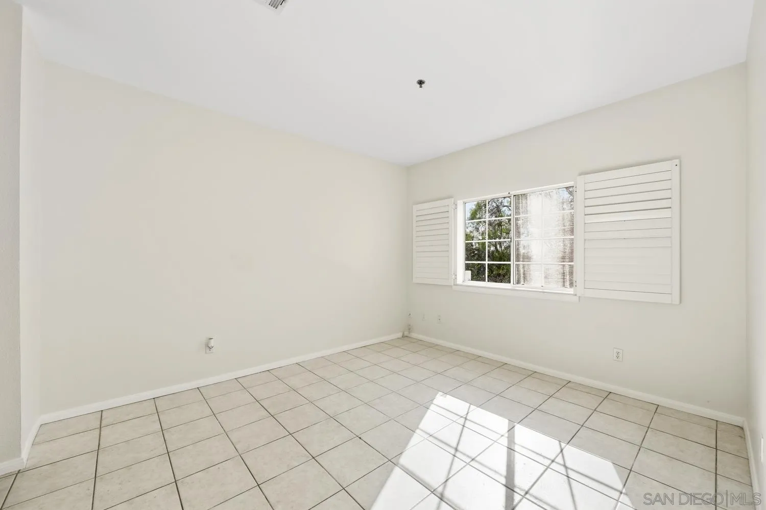 17161 Alva Road, Unit 2416 San Diego, CA 92127 - Photo 13 of 26 a view of an empty room with a window