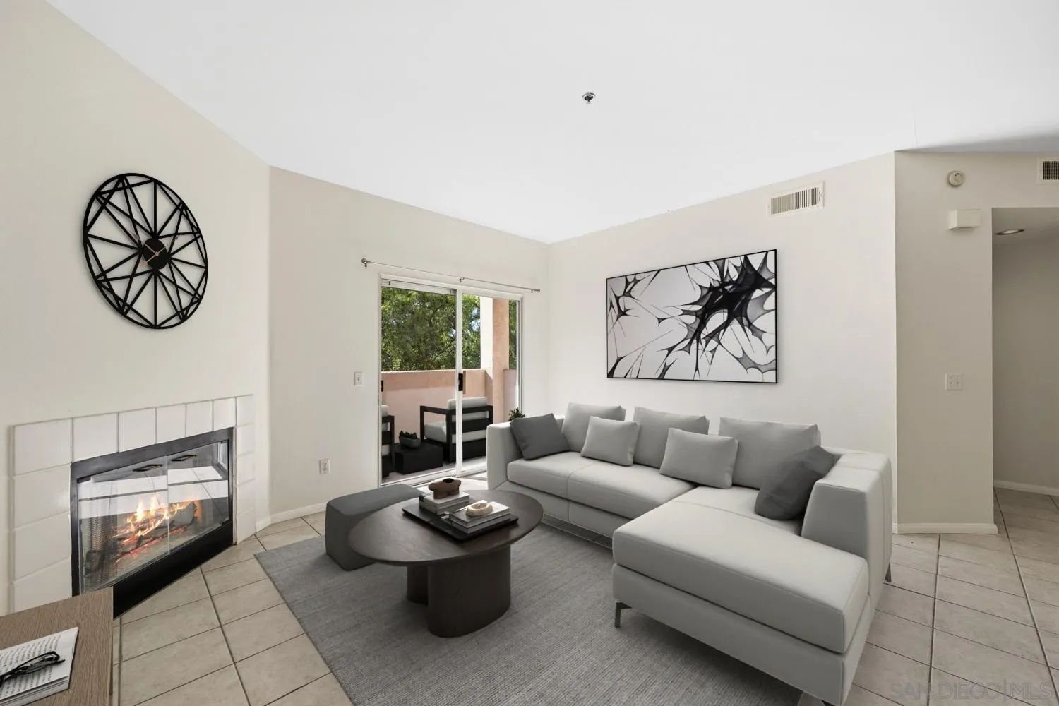 17161 Alva Road, Unit 2416 San Diego, CA 92127 - Photo 2 of 26 a living room with furniture and a fireplace