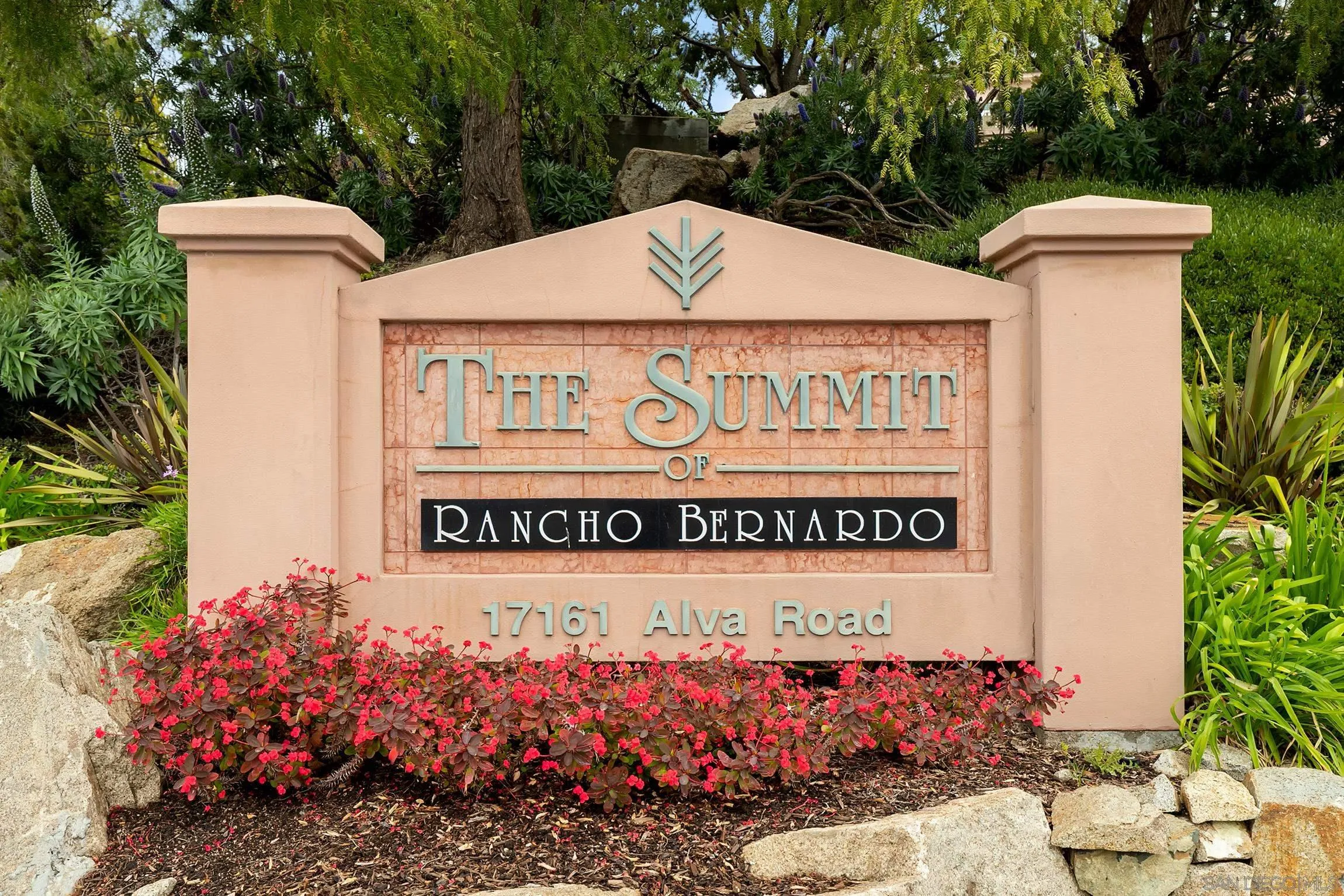 17161 Alva Road, Unit 2416 San Diego, CA 92127 - Photo 21 of 26 a sign that is sitting in front of flowers