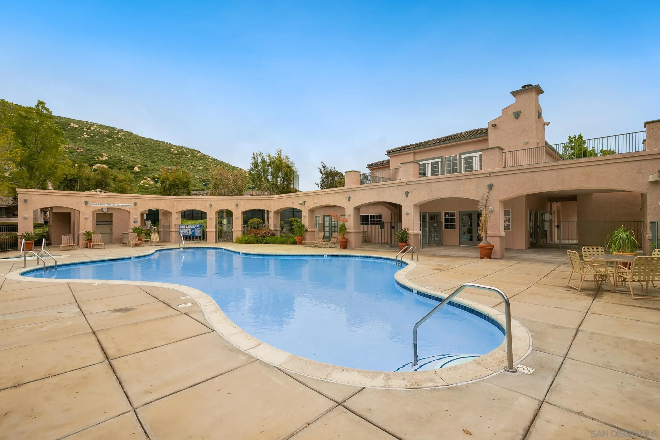 17161 Alva Road, Unit 2416 San Diego, CA 92127 - Photo 24 of 26 a view of a white house with a swimming pool and sitting area