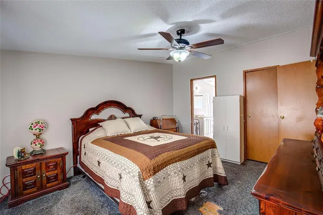 a bed room with a bed and a chandelier