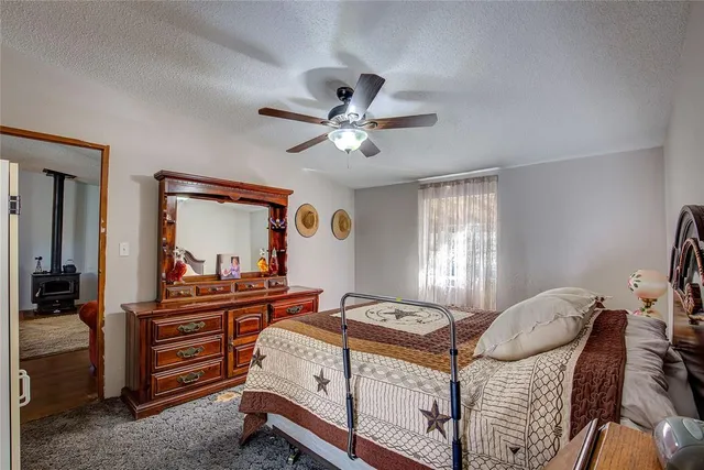 a bed room with a bed and a chandelier