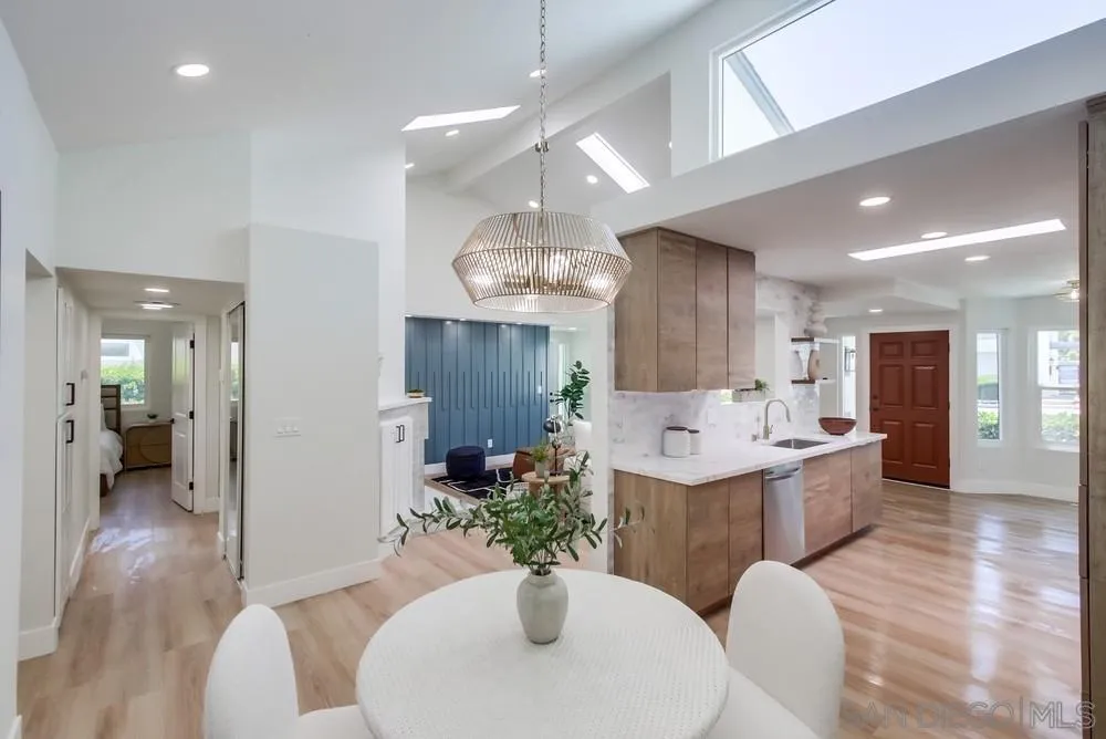 175 Bronze Way Vista, CA 92083 - Photo 11 of 33 a view of a dining room with furniture window and wooden floor