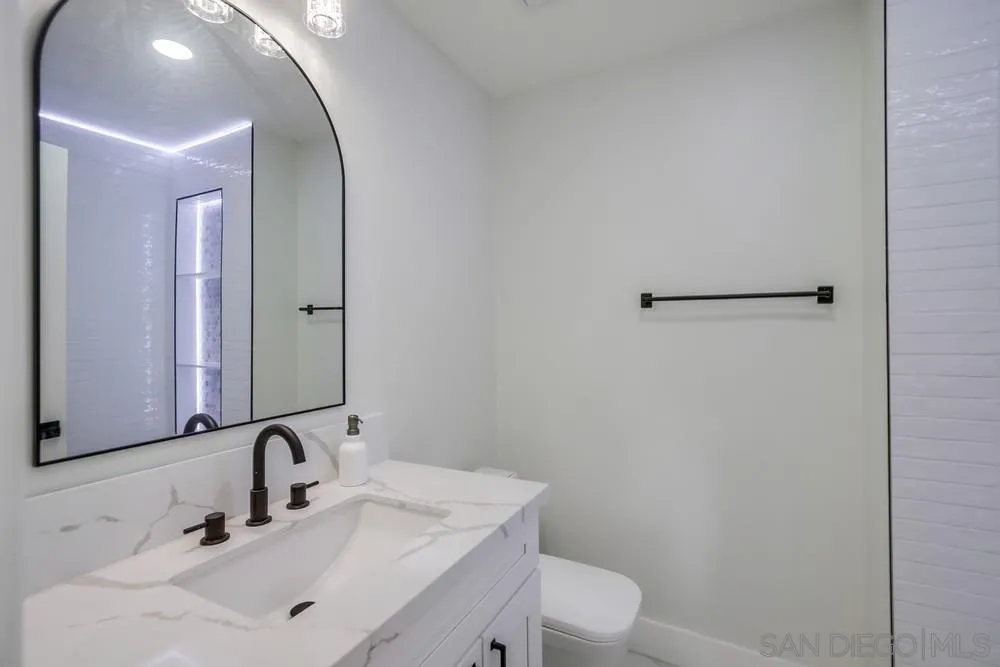 175 Bronze Way Vista, CA 92083 - Photo 13 of 33 a bathroom with a sink and a mirror