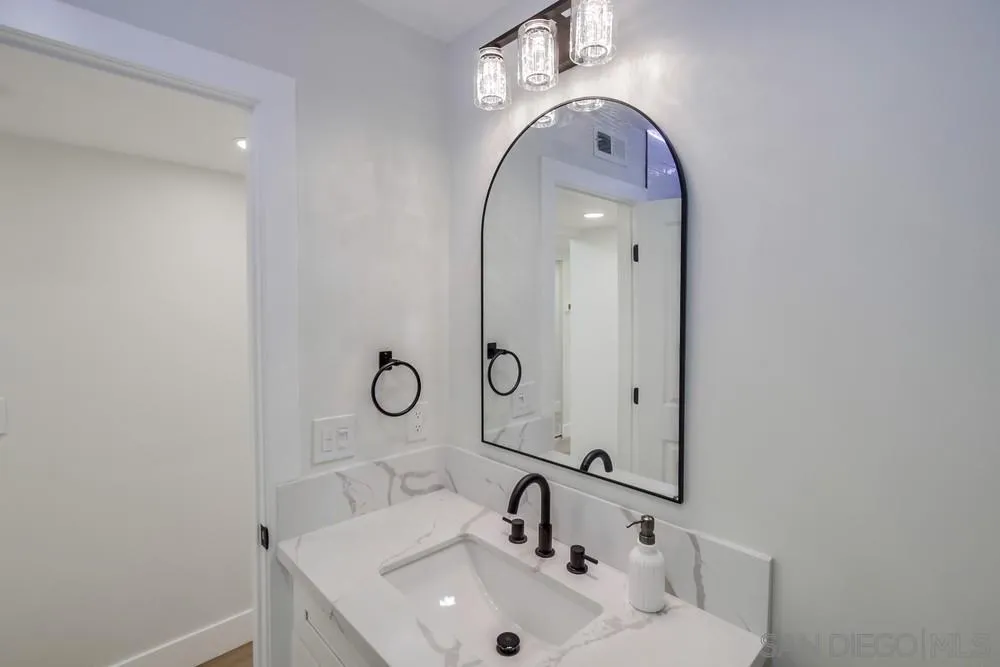 175 Bronze Way Vista, CA 92083 - Photo 15 of 33 a bathroom with a sink mirror and vanity