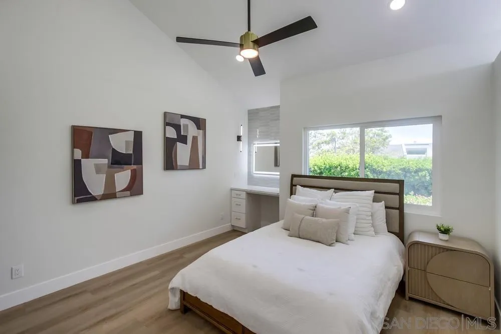 175 Bronze Way Vista, CA 92083 - Photo 17 of 33 a bedroom with a large bed and a window