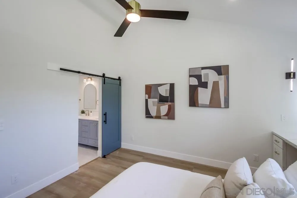 175 Bronze Way Vista, CA 92083 - Photo 18 of 33 a bedroom with a bed and bathroom