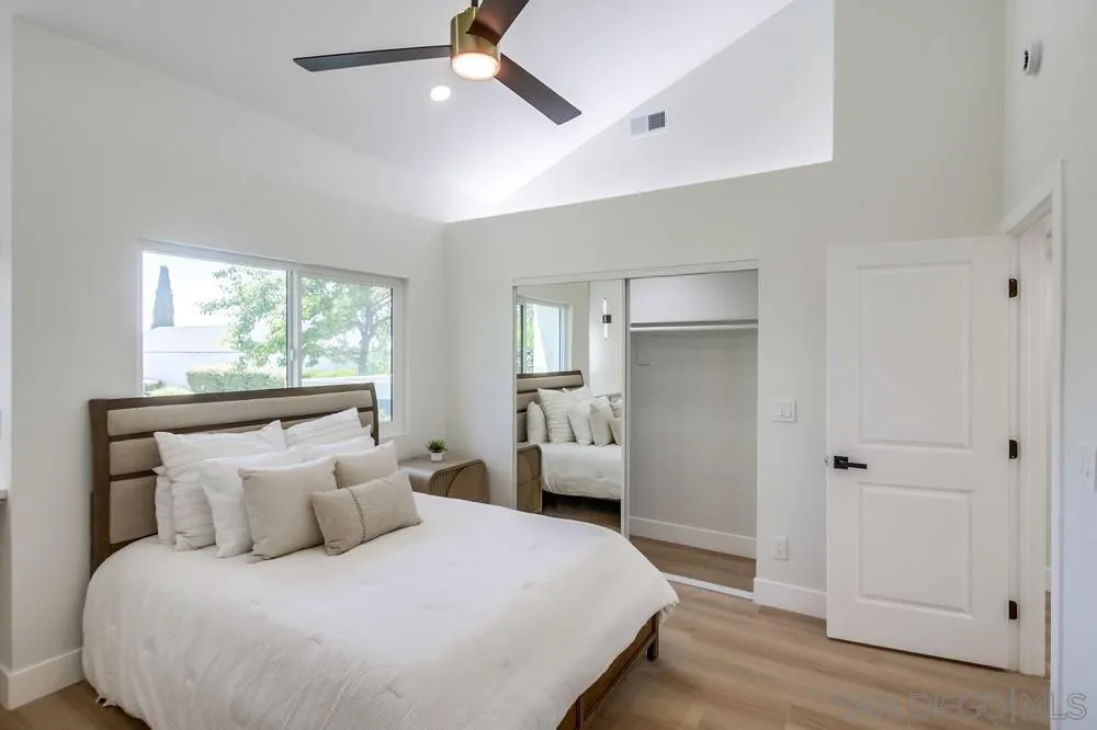 175 Bronze Way Vista, CA 92083 - Photo 19 of 33 a bedroom with a bed and a window