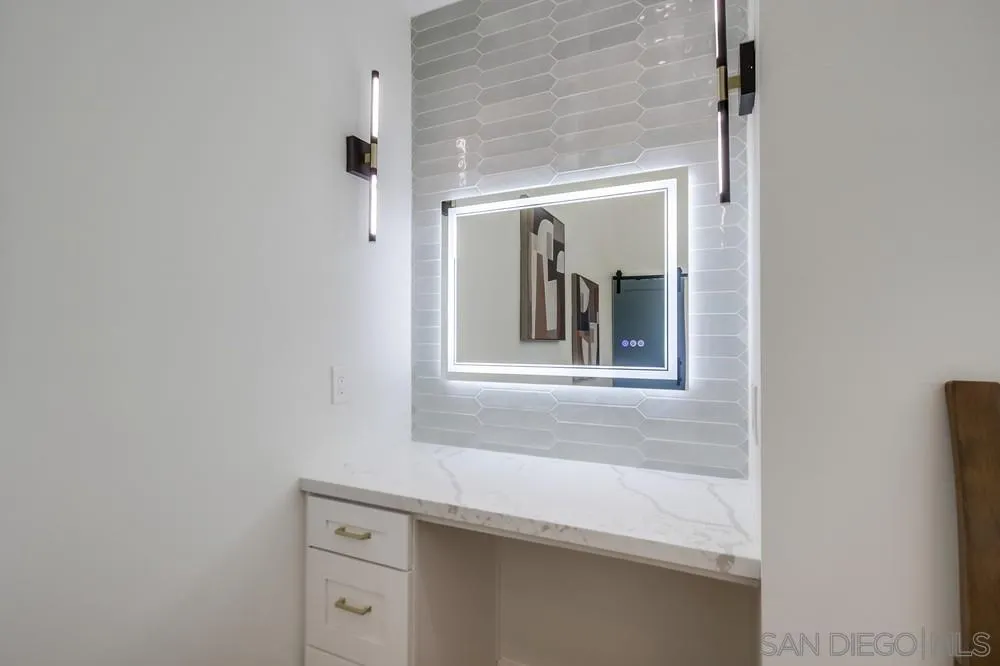 175 Bronze Way Vista, CA 92083 - Photo 20 of 33 a bathroom with a sink and a mirror