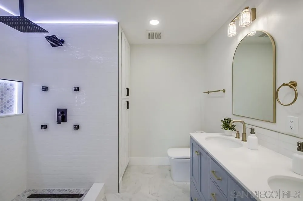 175 Bronze Way Vista, CA 92083 - Photo 22 of 33 a bathroom with a sink a toilet and shower