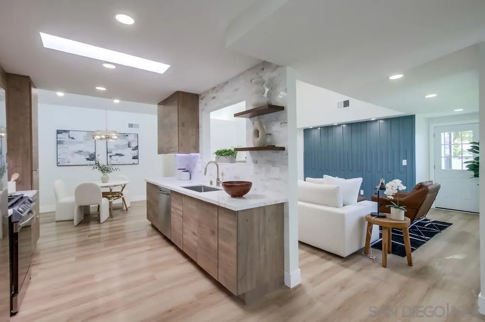 175 Bronze Way Vista, CA 92083 - Photo 5 of 33 a living room with furniture and a dining table with wooden floor