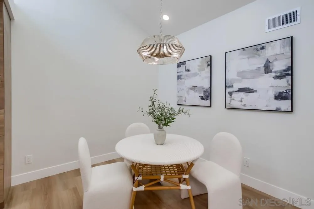 175 Bronze Way Vista, CA 92083 - Photo 9 of 33 a view of a dining room with furniture and a chandelier