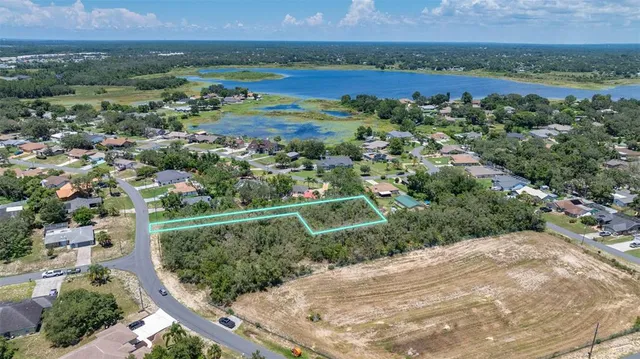 an aerial view of house with yard
