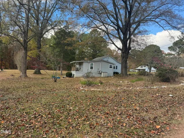 a kitchen with granite countertop a sink stove and cabinets