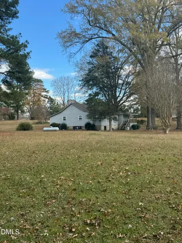 a kitchen with cabinets stainless steel appliances and window