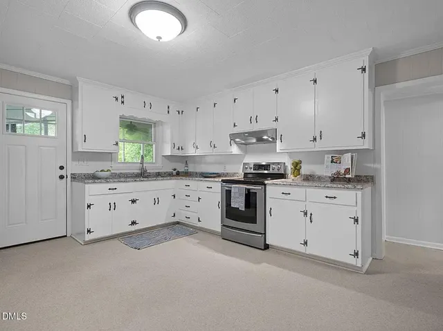 a view of an empty room with a fan